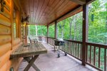 Main Level Covered Deck Offers Ample Seating, Gas Grill, and Hours of Relaxation